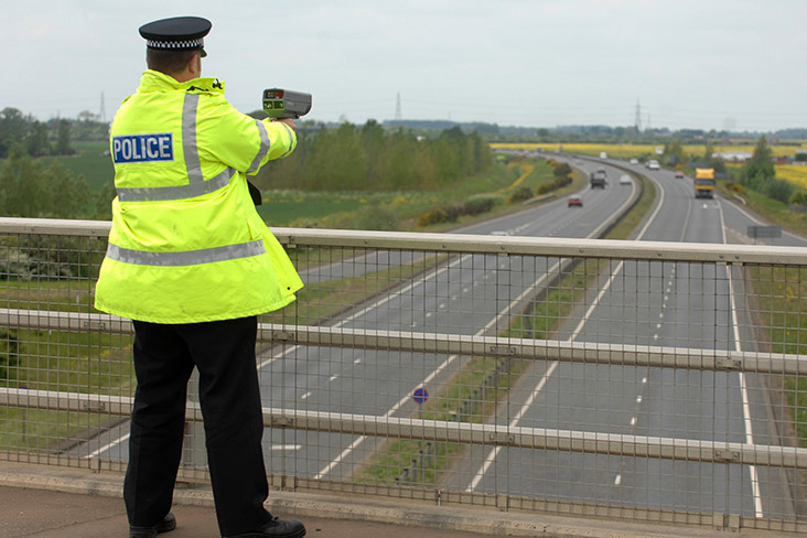 Policeman with speed gun