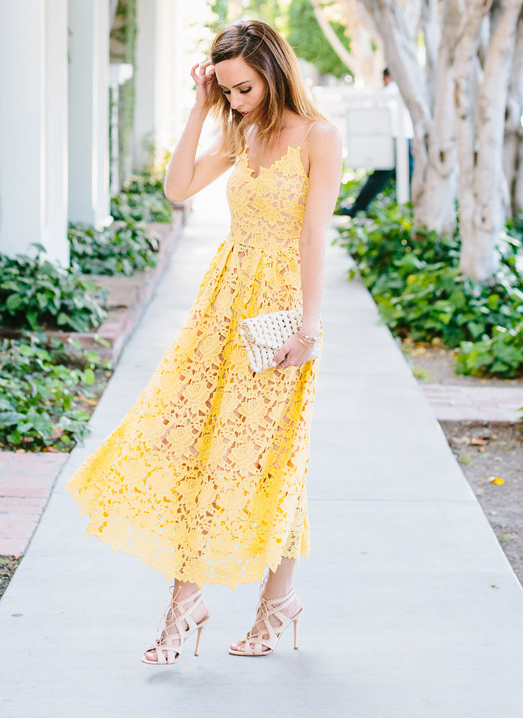 Sydne Style shows how to wear a white lace dress for fall outfit ideas