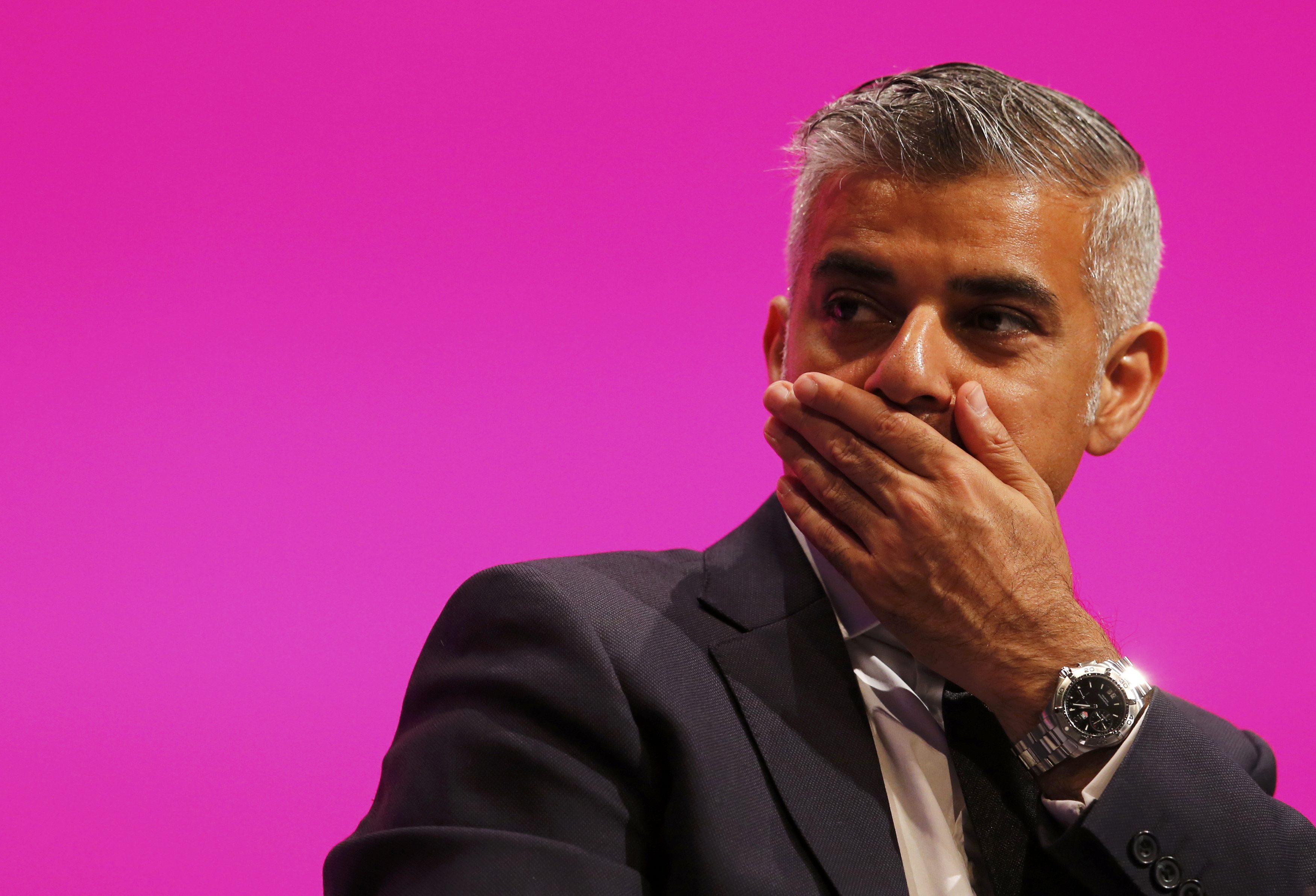Shadow Justice minister Sadiq Khan, reacts as he listens to Yvette Cooper, Britain's opposition Labour Party's shadow home secretary speaks at the party's conference in Manchester
